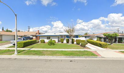 A White Color Painted House With a Lawn