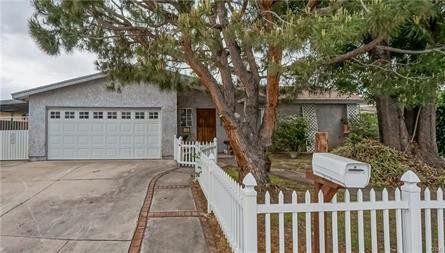 A House With a Picket Fence in White Color