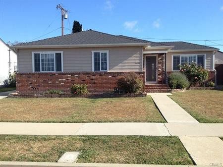 A Roof of a House With a Green Color Lawn