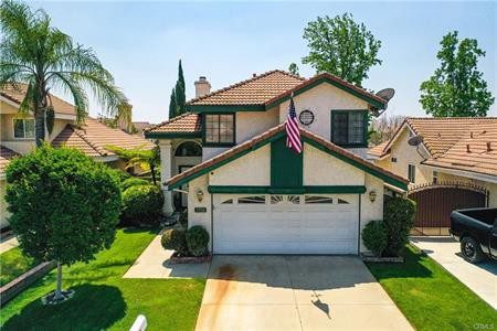 An American Flag Hanging on a House