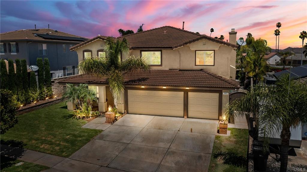 A House Driveway With Glowing Lights in Dusk